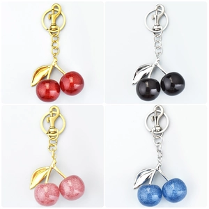Glitter resin cherry keychains set with metal leaves in red black pink and blue