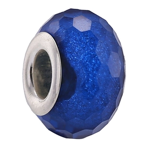 Macro shot of a faceted blue resin bead with a polished silver-tone metal core for DIY bracelets