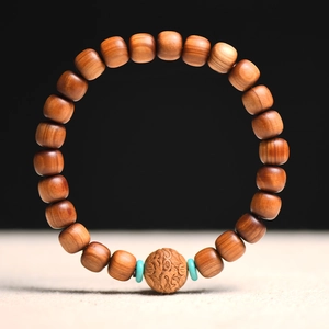 Classic Thuja wood beaded bracelet with carved center bead and turquoise accents