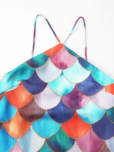 Detail of mermaid scale print on backless maxi dress with colorful gradient and gold lines