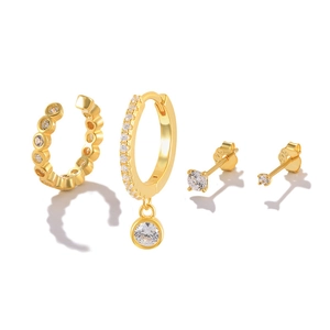 Close-up of four-piece gold S925 silver earring set with crystals and ear cuffs