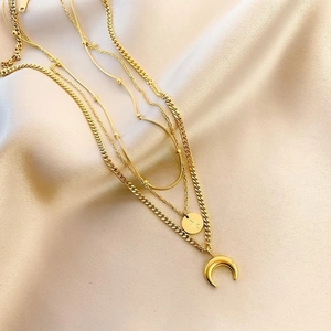 Multi-layer gold titanium steel necklace featuring crescent moon and circular coin pendants