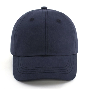 Detail of navy blue cotton baseball cap with twill texture and reinforced stitching