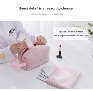 Detail of pink velvet makeup bag set with gold embroidery showing high capacity storage