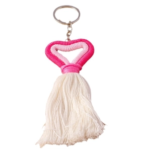 Knitted heart keychain with pink tassels and premium metal ring on a white background