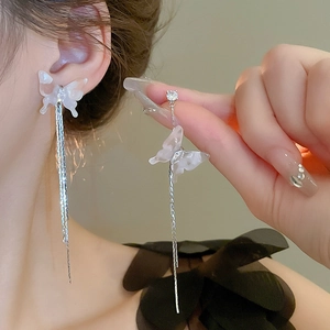 Elegant asymmetrical butterfly tassel earrings with white resin and cubic zirconia