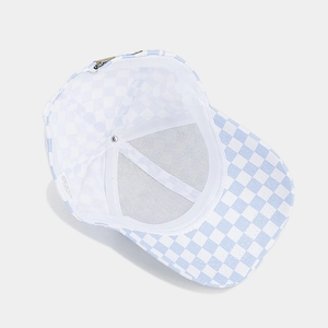 Detail of blue and white checkered cap interior with adjustable buckle and stitching