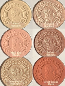 Detailed palette view showing six embossed powders in matte, pearl, and diamond textures