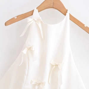 Elegant white sleeveless halter dress for girls featuring satin bow decorations