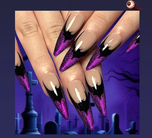 Detail of long stiletto press-on nails with purple glitter and black Halloween bat patterns