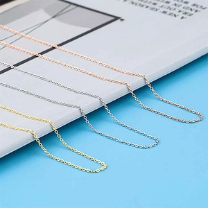 Detailed view of stainless steel cable chains in rose gold, silver, and gold finishes