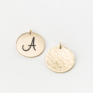 Polished and hammered 18k gold plated stainless steel round pendants with A engraving