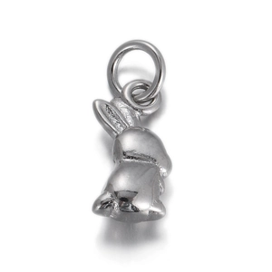 Macro shot of a polished silver rabbit pendant for DIY jewelry bracelets and necklaces