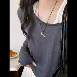 Korean style crescent croissant pendant on black cord necklace worn by model