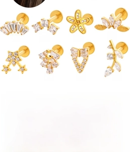 Detail of F136 titanium labret studs with zirconia in various geometric gold shapes