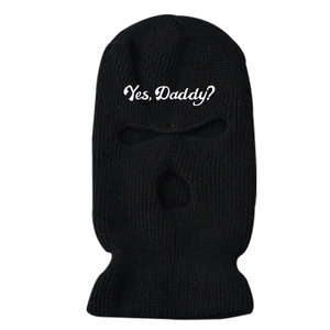 Black knitted three-hole ski mask with Yes Daddy text on white background