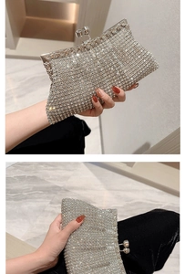 Close-up of sparkling silver rhinestone evening clutch with crystal snap closure