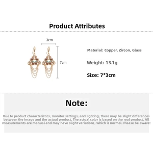 Detailed view of bohemian tassel earrings featuring copper, zircons and glass beads