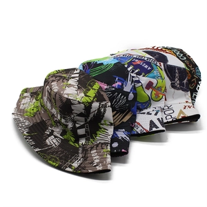 Tropical leaf and graffiti print bucket hats for women in various stylish colors