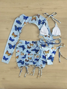 Detail of four-piece butterfly print bikini set with mesh cover-up and drawstring skirt