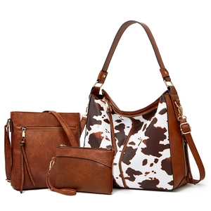 Three-piece women bag set with cow print tote, brown crossbody bag and clutch purse