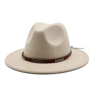 Detail of beige wool fedora with brown band and retro metal buckle ornament
