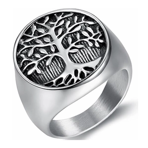 Close-up of titanium steel ring featuring detailed Tree of Life relief and vintage finish