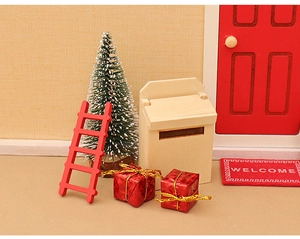 Miniature dollhouse Christmas decor set with red wooden ladder, snowy tree, and mailbox