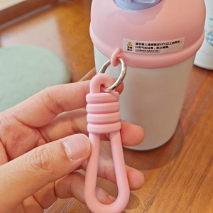 Detail view of the pink silicone handle and metal buckle on the cute insulated water bottle