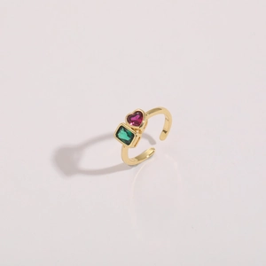 Detail of 14K gold-plated open ring with emerald-cut green and heart-shaped pink zircon