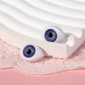 Macro view of 14x19mm purple boat-shaped acrylic doll eyes with realistic iris texture