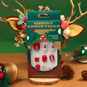 Christmas theme soft gel press-on nails with Santa and tree patterns in festive packaging