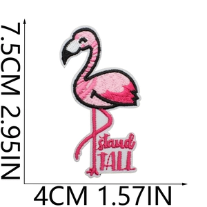 Detailed flamingo embroidery patch with stand TALL text showing dimensions 7.5cm x 4cm