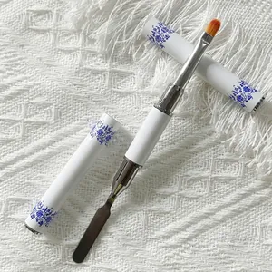 Dual-head nail art tool with stainless steel spatula and fiber brush in porcelain design