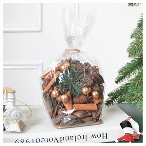 DIY Christmas decoration set with pine cones, cinnamon sticks and golden ornaments