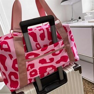 Pink leopard print travel bag with luggage strap and waterproof oxford fabric