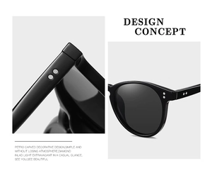 Close-up of black polarized sunglasses featuring silver rivet details and sleek design
