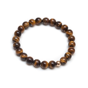 Detailed view of natural tiger eye stone beads and rose gold metal bead on bracelet