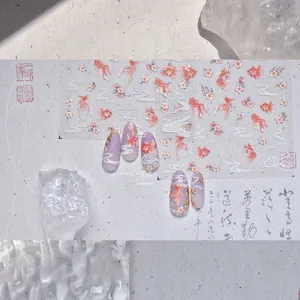 Detail of embossed koi fish and cherry blossom nail art stickers with white water ripples