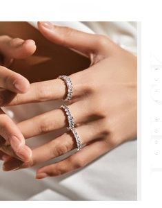Close-up of double layered s925 silver rings with pavé set sparkling zircon stones