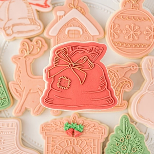 Christmas fondant cookie mold set featuring Santa, reindeer, and gingerbread house shapes