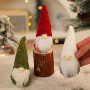 Detailed trio of knitted Christmas gnomes with long plush beards on rustic wood bases