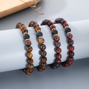 Tiger eye and lava stone beaded elastic bracelets set for men and women on a display