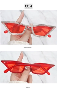 Detail view of red cat-eye sunglasses featuring double-row rhinestone crystal embellishments