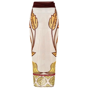 Detail of leaf print sarong with brown waist belt and ethnic patterned hemline