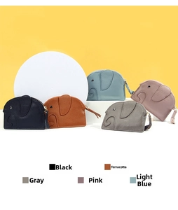 Detailed view of elephant-shaped leather coin purses in black brown grey pink and blue colors