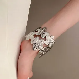 Exaggerated silver metal flower cuff bracelet with 3D sculpted floral design for women