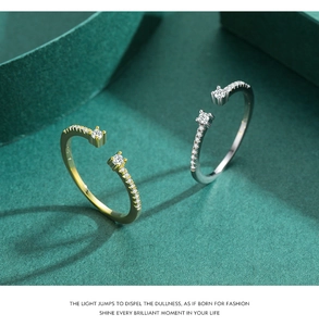 Close-up of gold and silver S925 sterling silver adjustable rings with micro-pave crystals