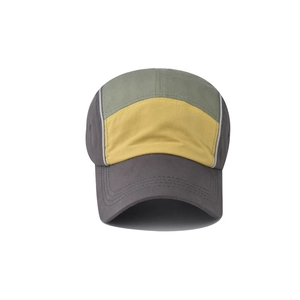 Detail of five-panel cotton baseball cap with charcoal, yellow, and green color blocking