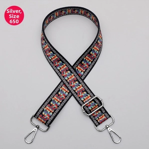 Detail of adjustable 38mm wide ethnic pattern bag strap with silver metal hooks